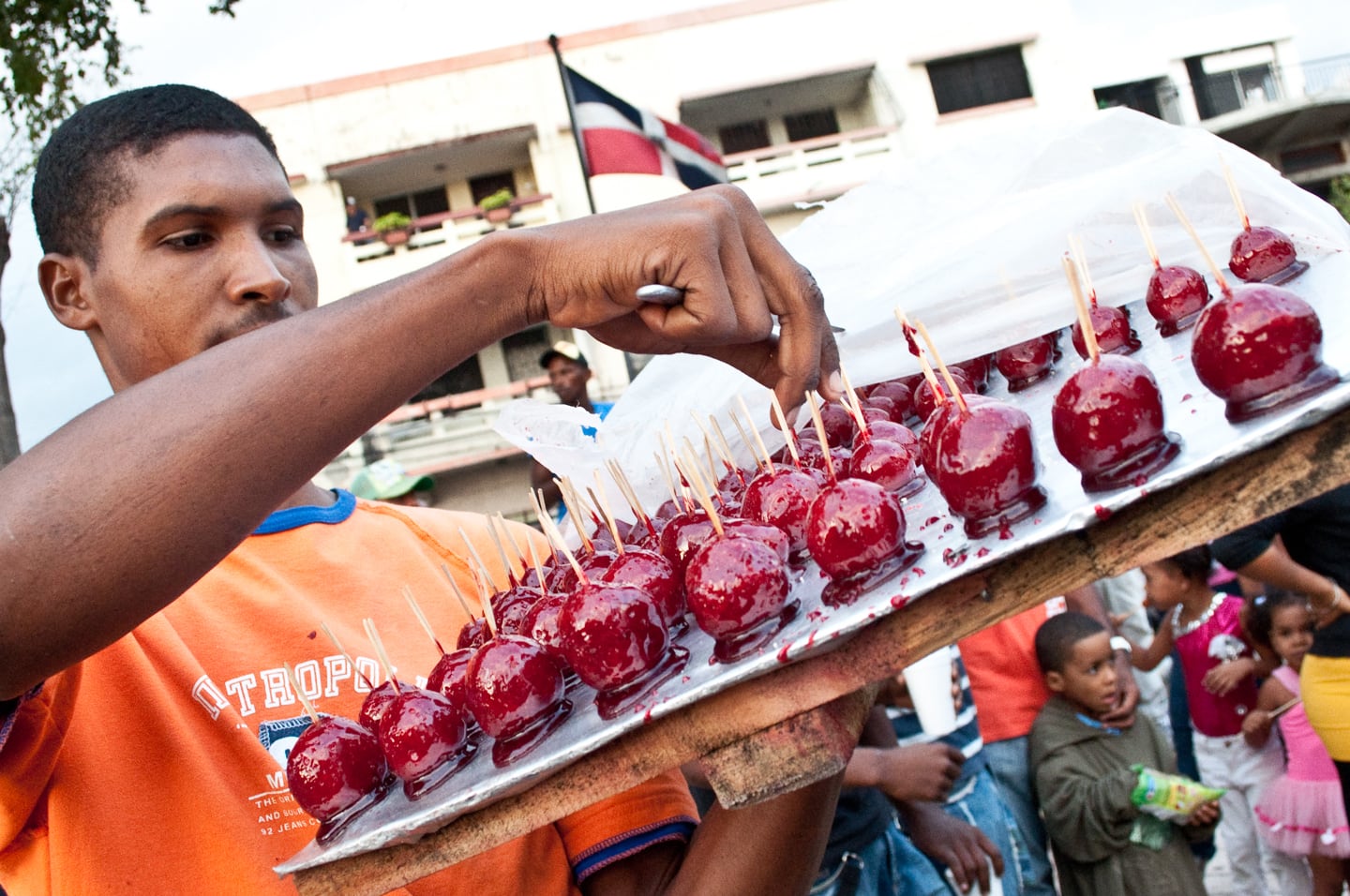 vendor selling sweet red treats on the street