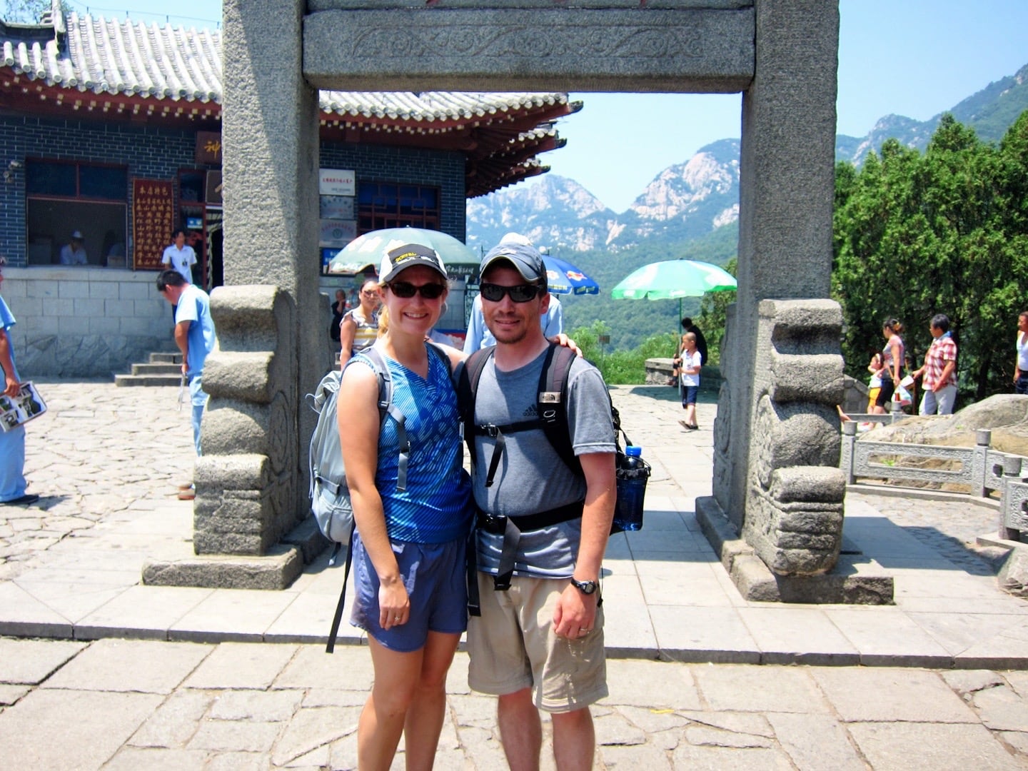 Two people standing in front of an archway