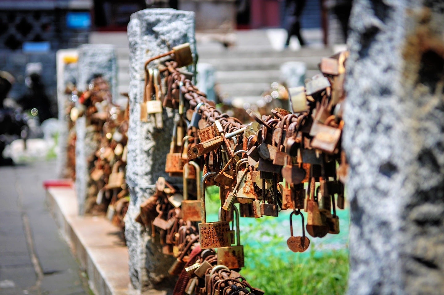 Rusty brass locks locked to a chain