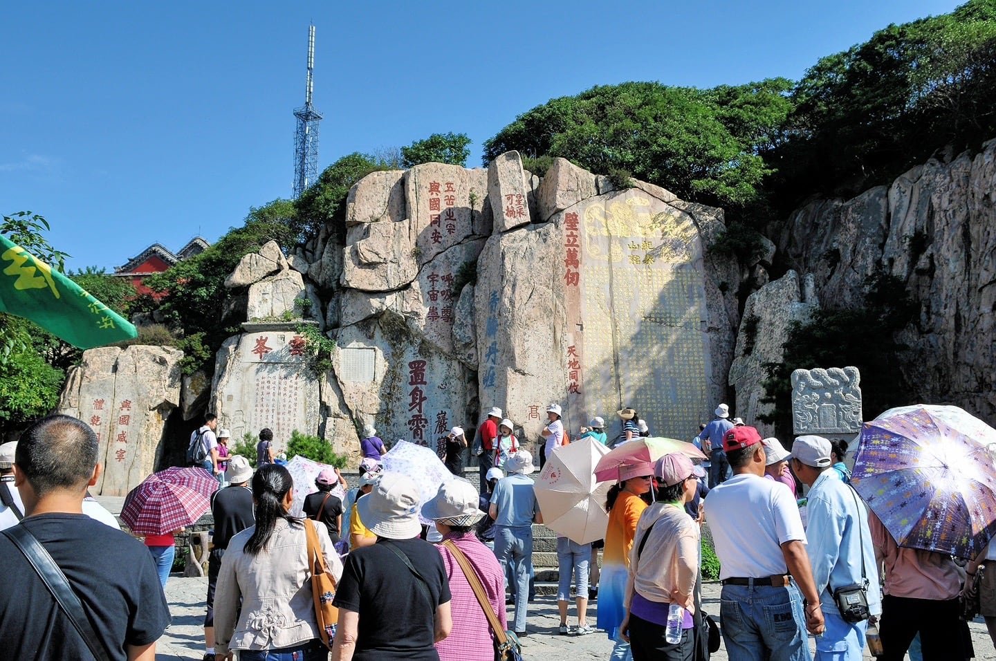 crowds in front of large stone slabs with Chinese inscription