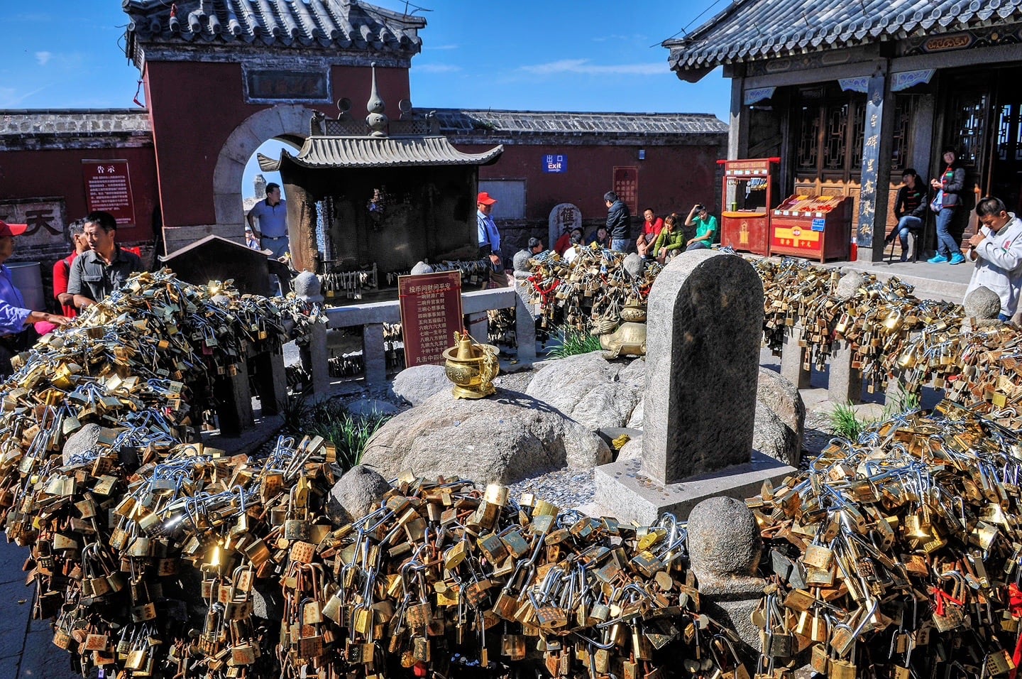 Thousands of brass locks around a fence