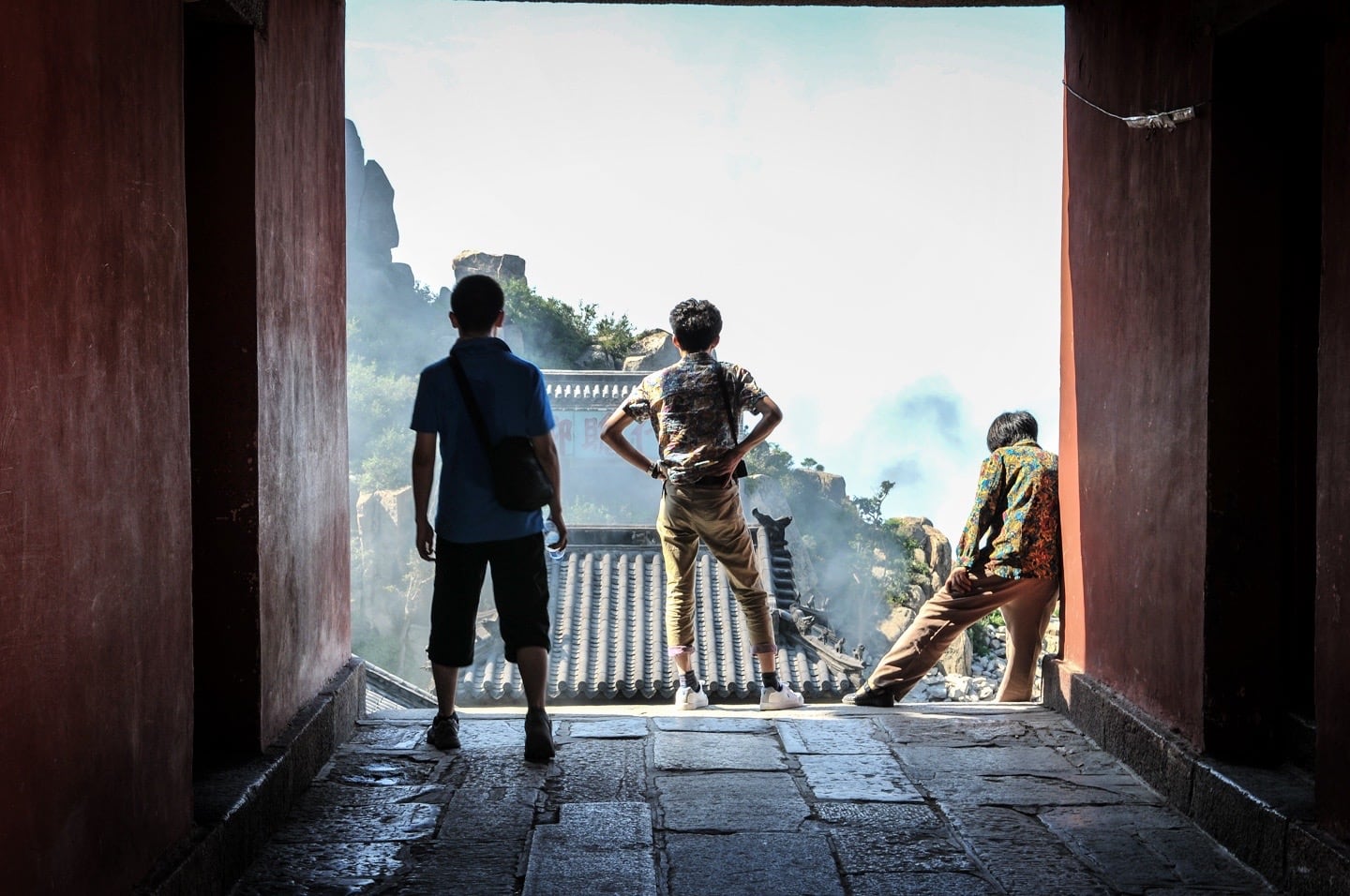 Boys looking out from mountain top