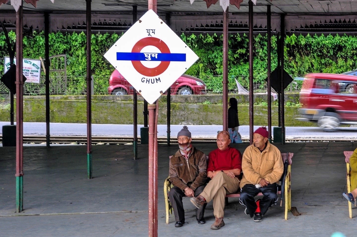 three men wait at Ghum Darjeeling Toy Train