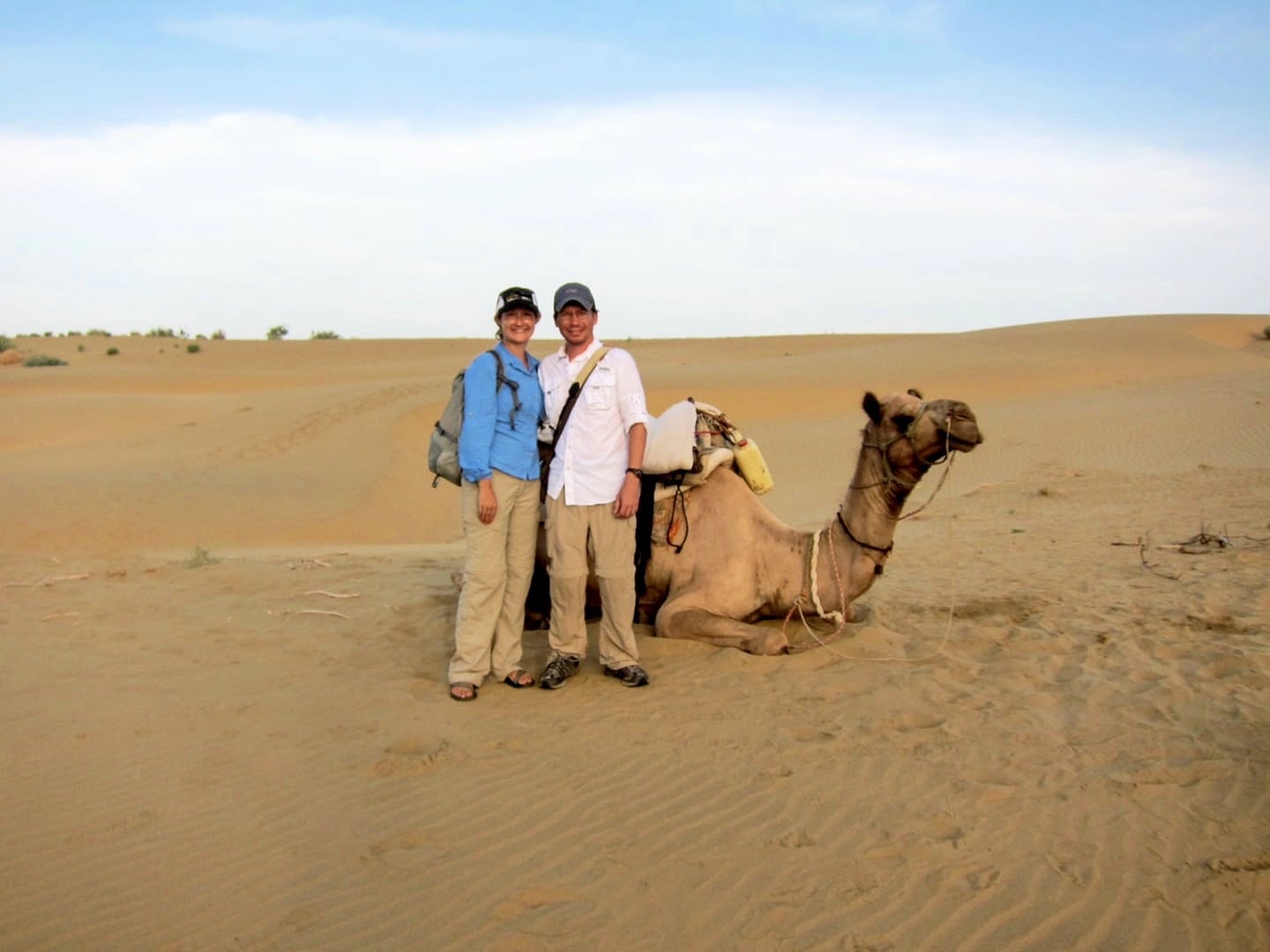 people and camel in the Khuri sand dunes