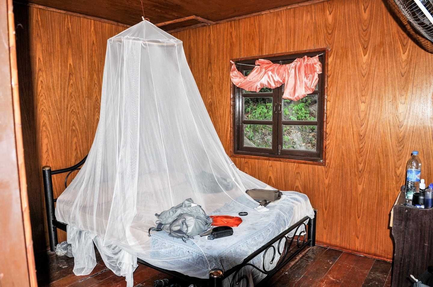 bed with bed net in beach hut