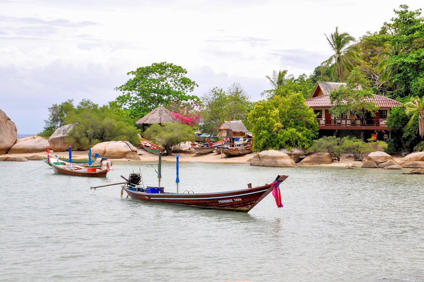 long tail boat in serene bay Chalok Baan Kao Beach Koh Tao Thailand