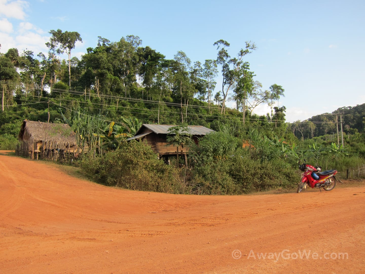 motorbike parked in small village on the thakhek loop in laos