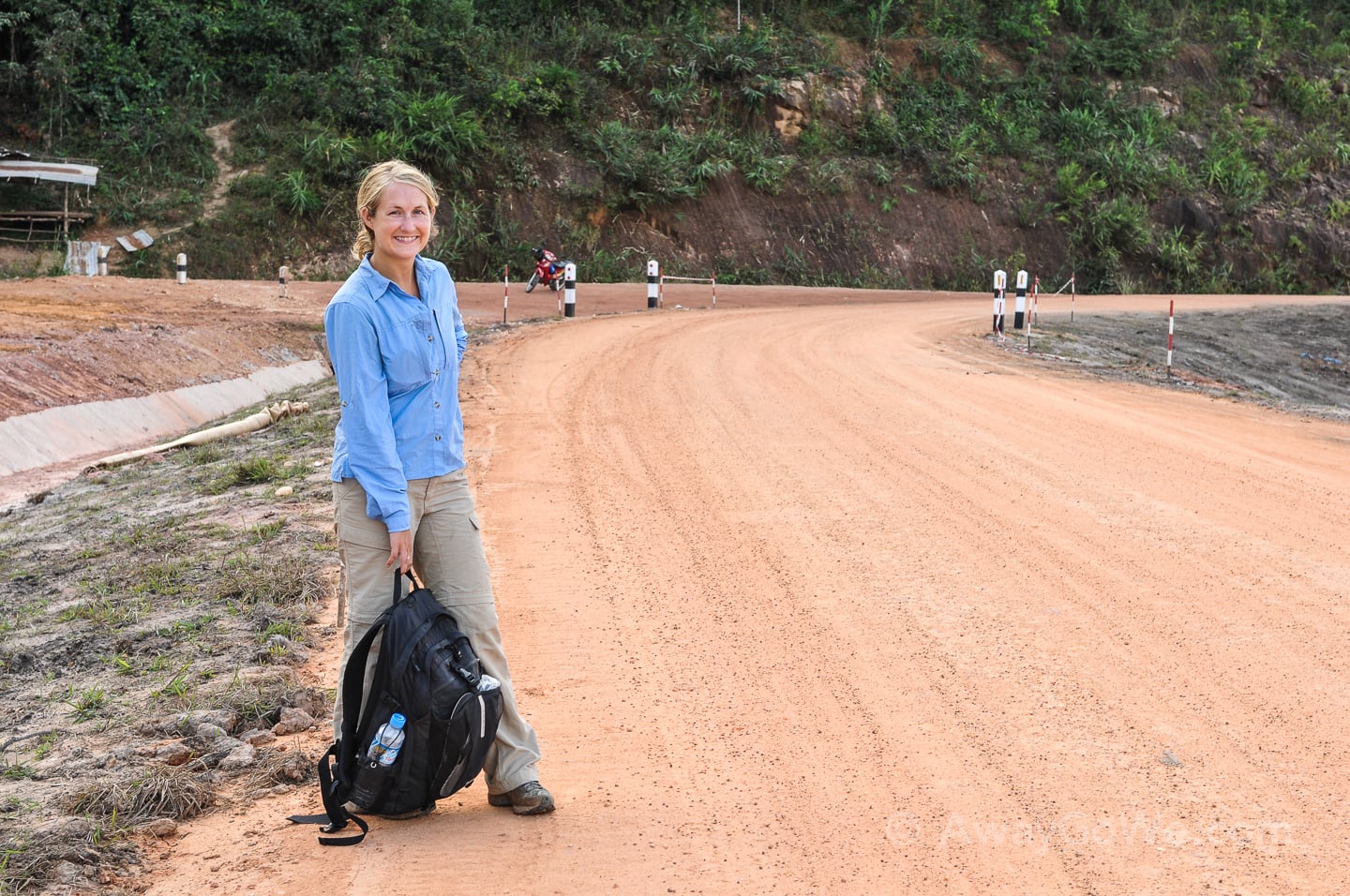 standing along unsealed road on the thakhek loop in laos