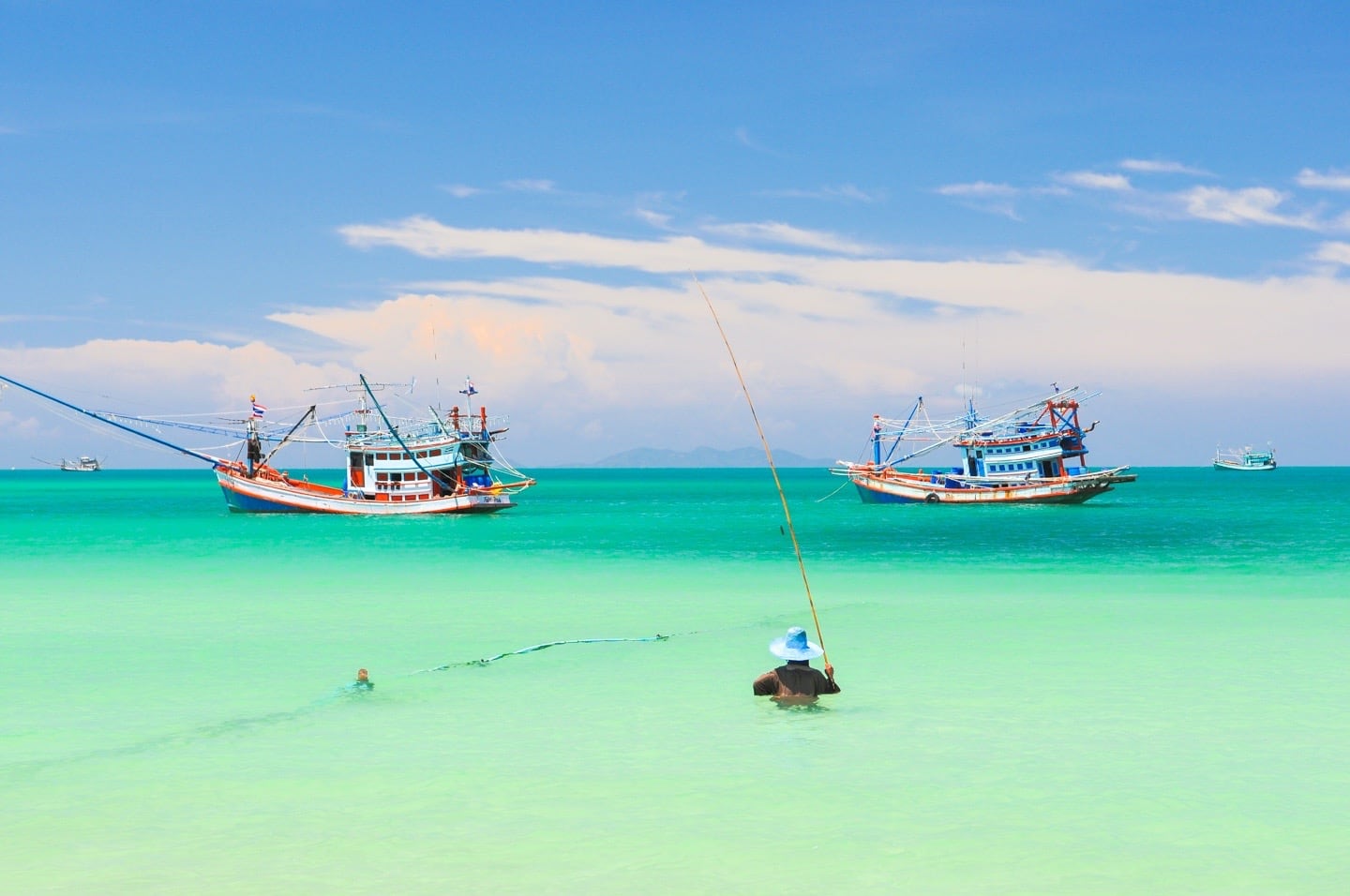 fishing boats and fisher in Chaloklum Beach Koh Phangan Thailand