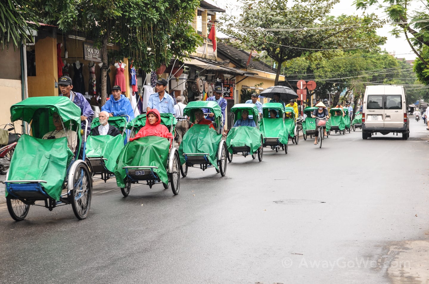 tourists in rainy season Hoi An Ancient Town