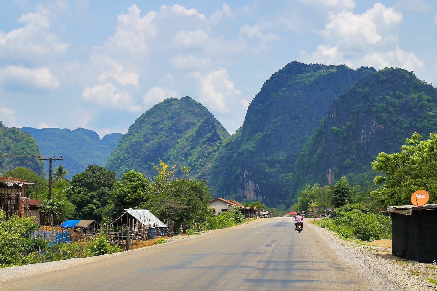 Thakhek Loop karst peeks and highway with motorcycle