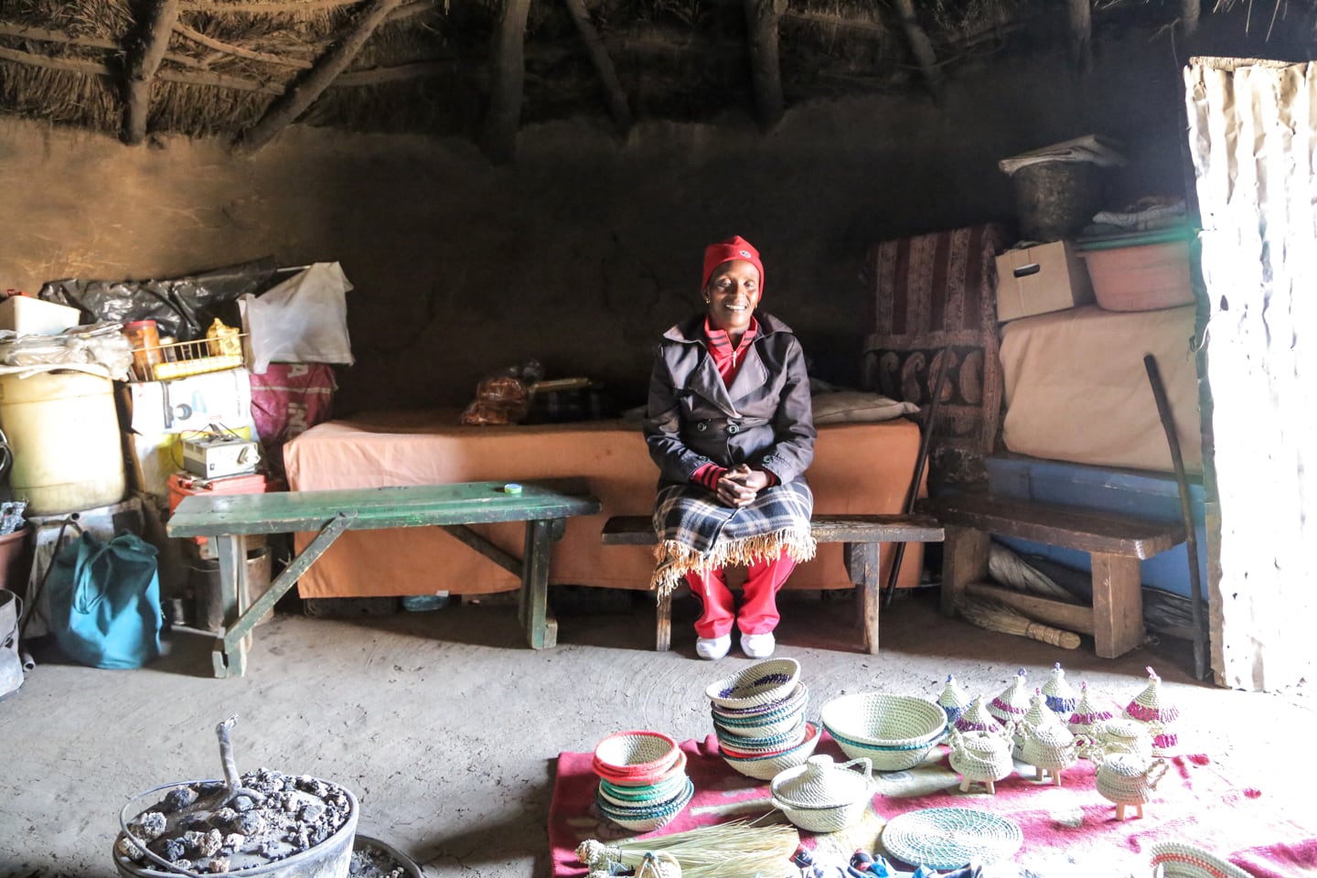 woman selling handicrafts at Lesotho trading settlement
