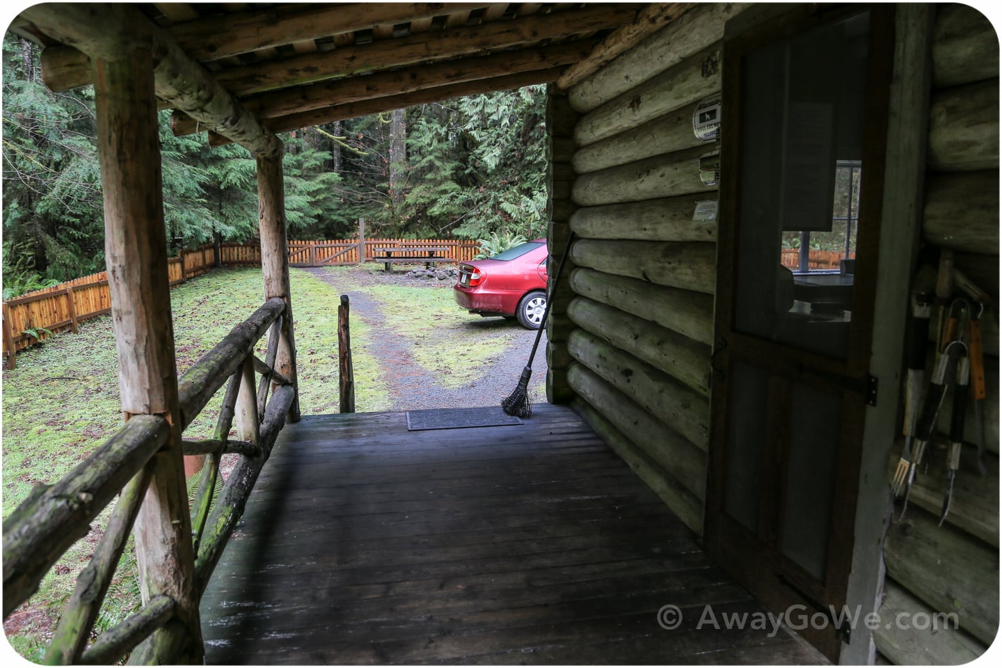 front of rustic log cabin