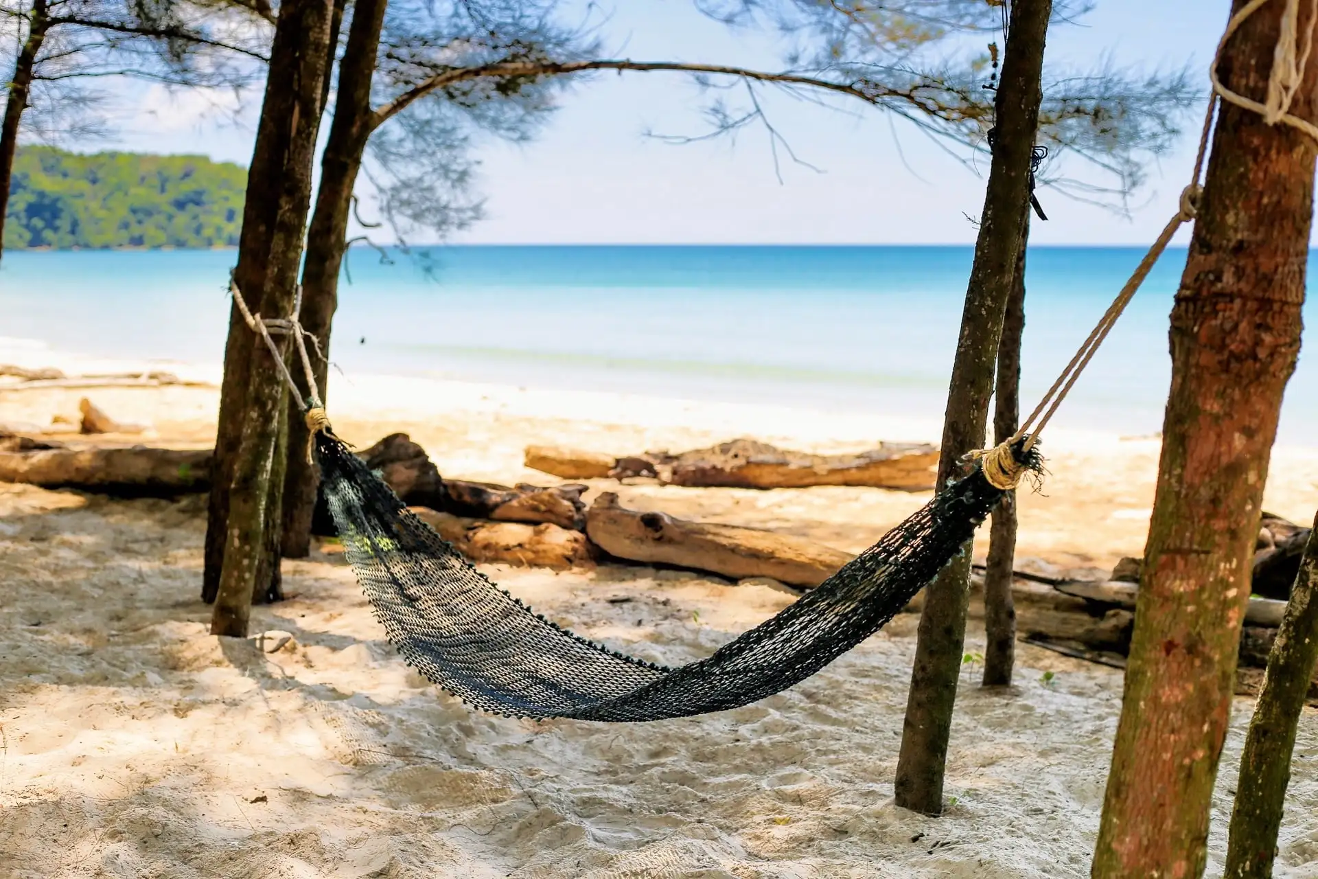 hammock between trees secret beach borneo