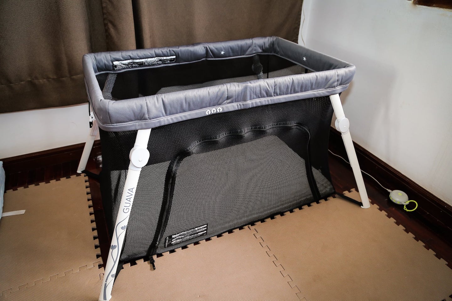 Guava Lotus Travel Crib review set up in room for toddler
