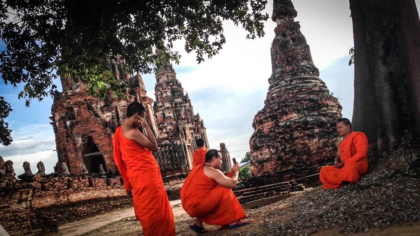 Buddhist monks at ancient temple of Ayutthaya day trip