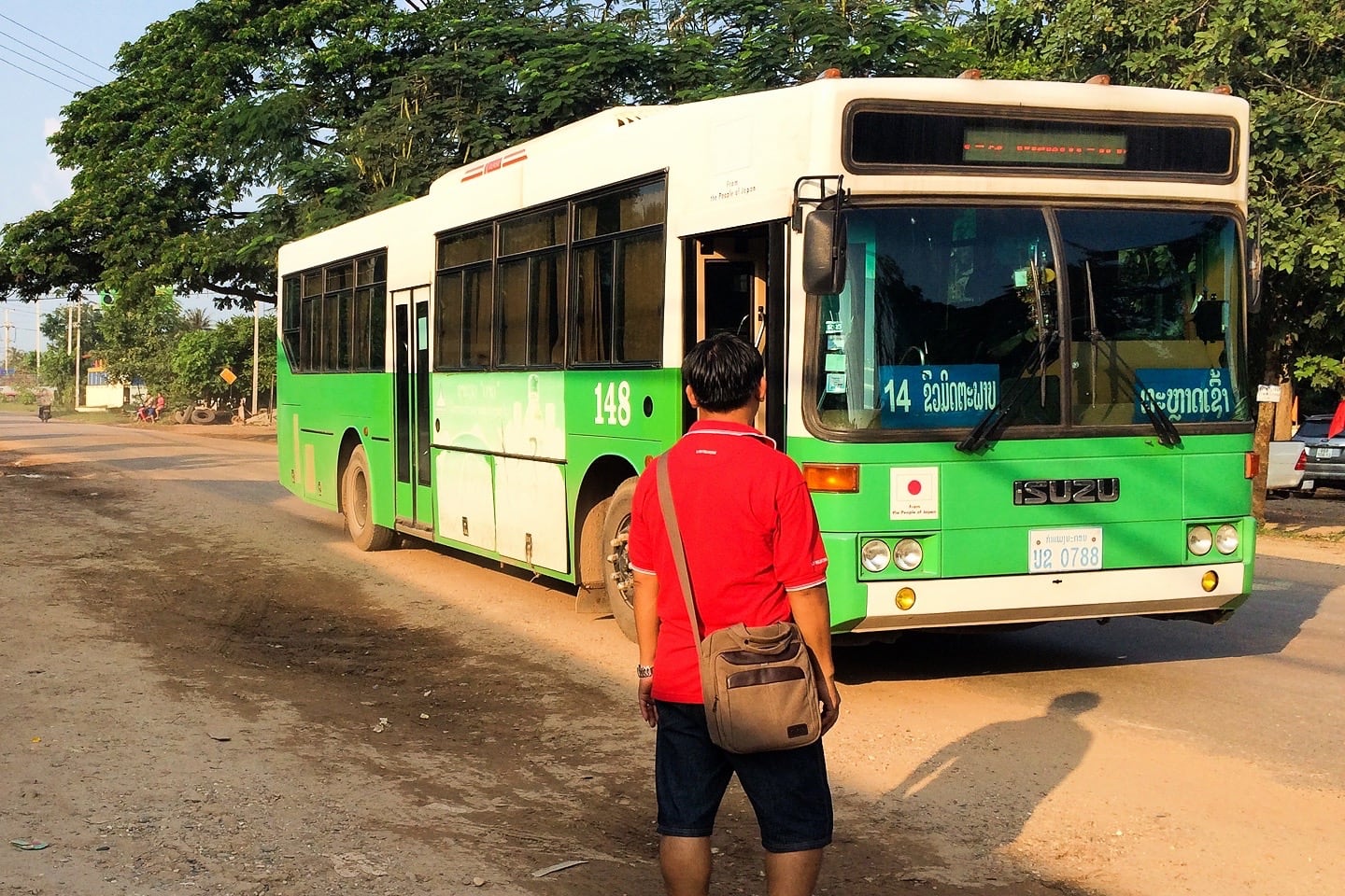 man walking towards bus