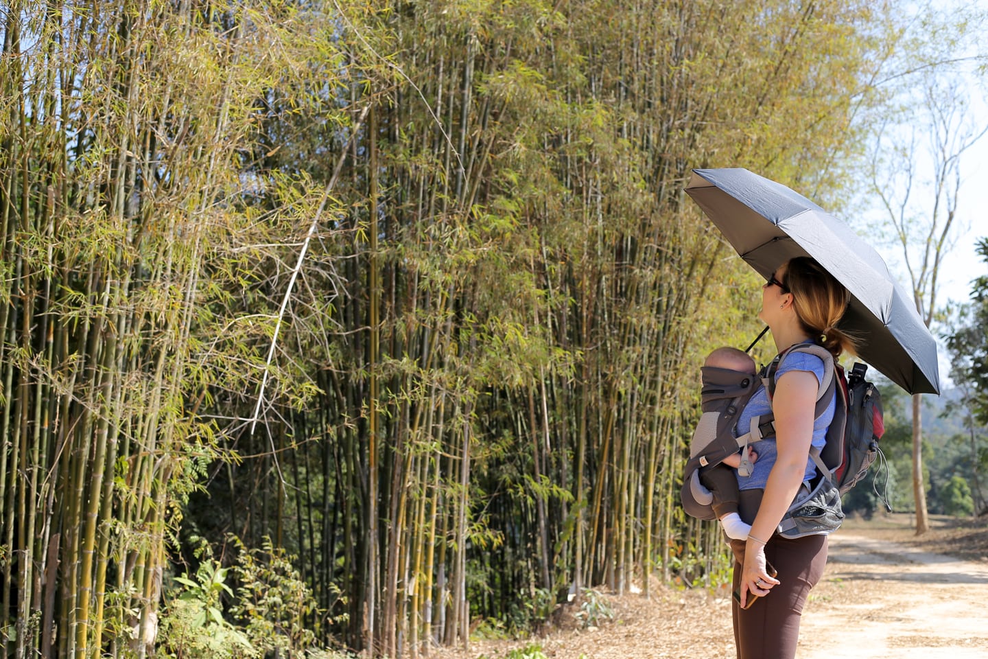 woman and baby looking at bamboo stand