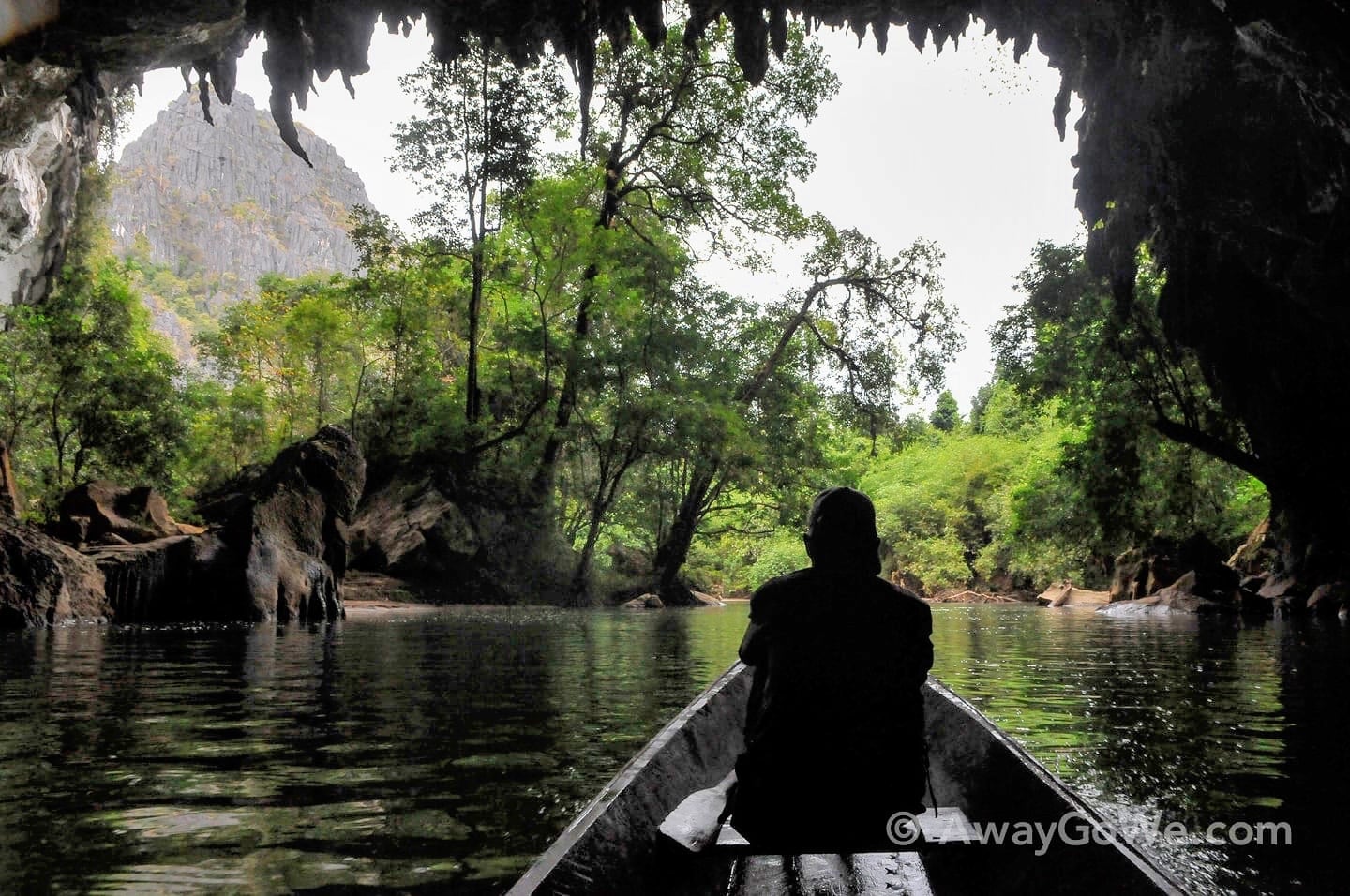 boat going through cave in Laos