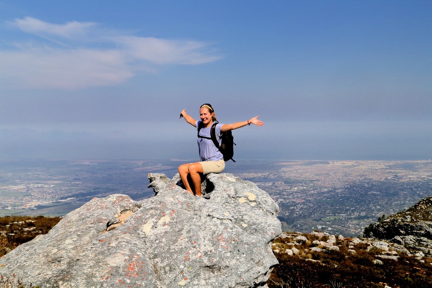 Hiker sitting on Table Mountain summit False Bay