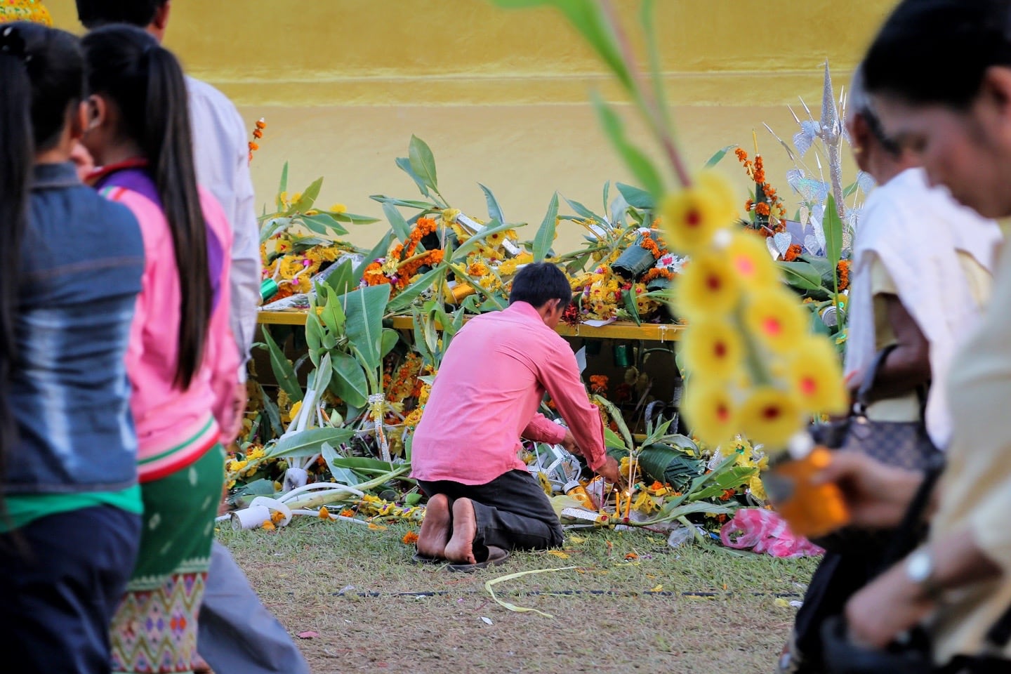 offerings and wax candles in Laos