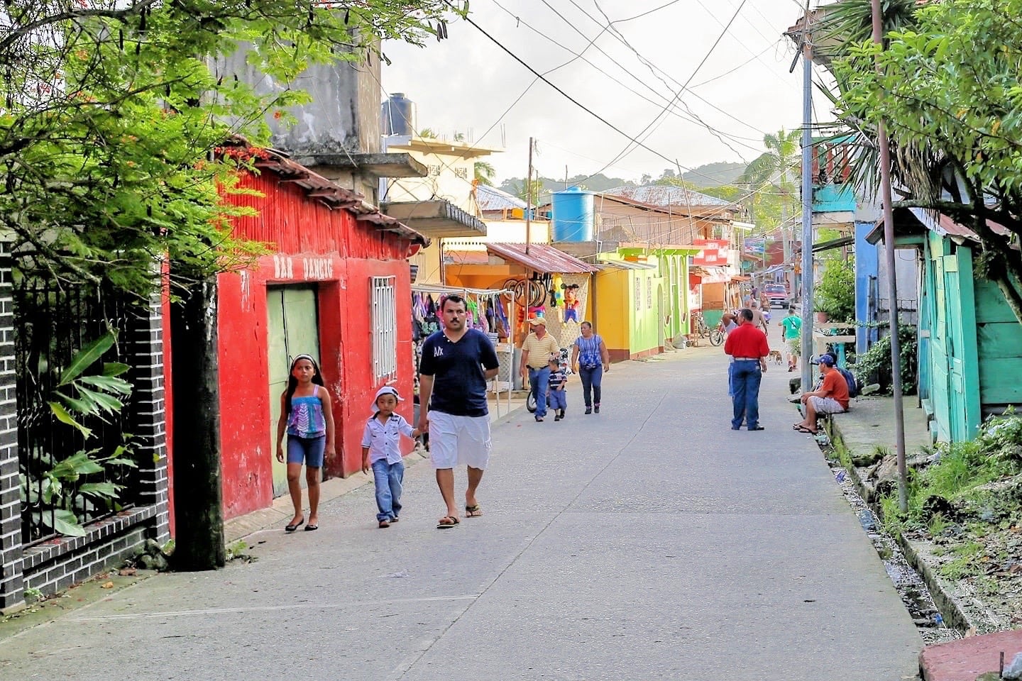 family strolling at sunset in Livingston Guatemala