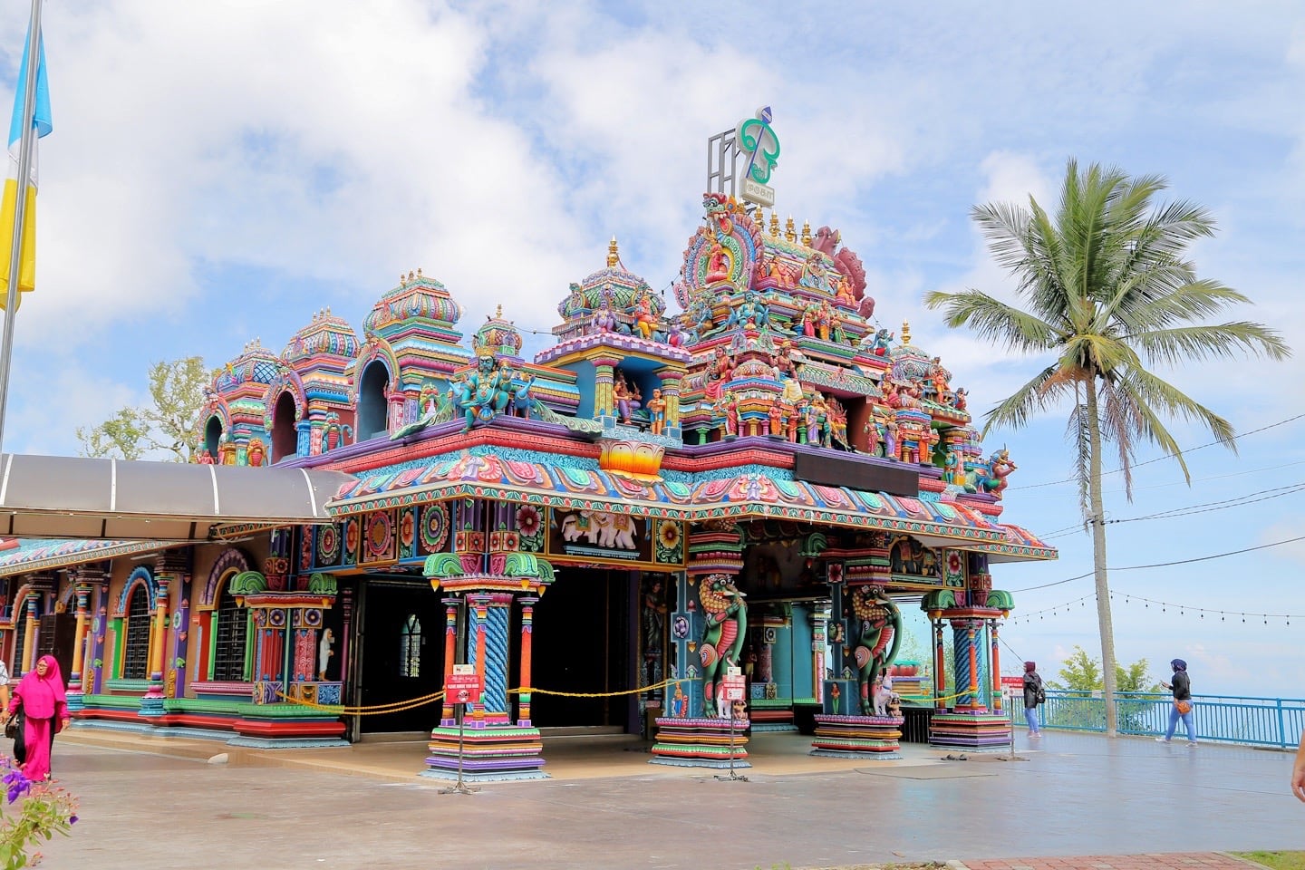 colorful Hindu Temple on Penang Hill will palm tree