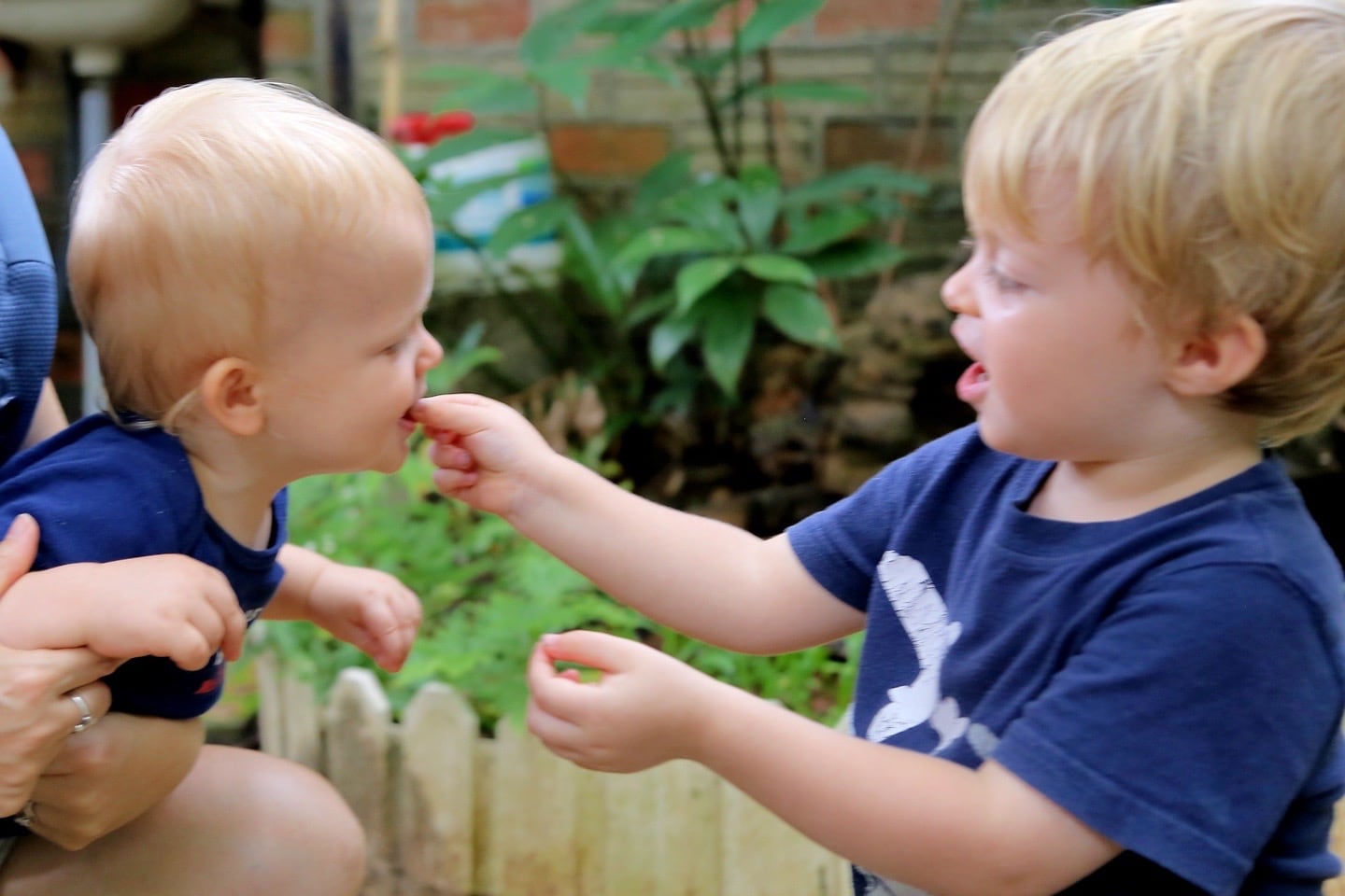 child feeding another child