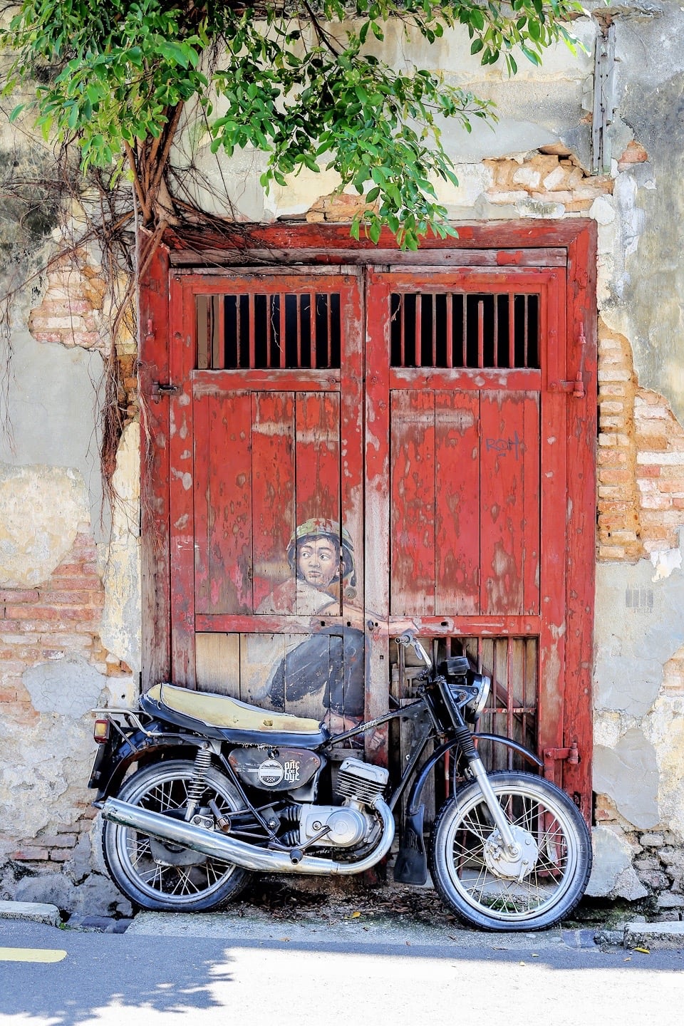 boy on moto George Town Penang Street Art