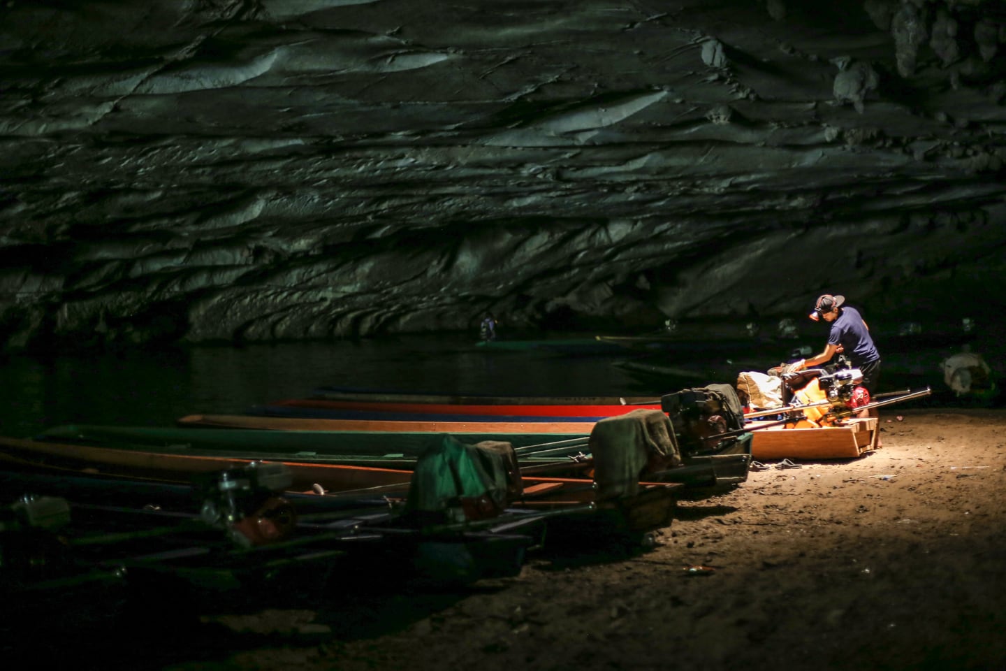 long tail boats waiting to ferry passengers through Kong Lor Cave