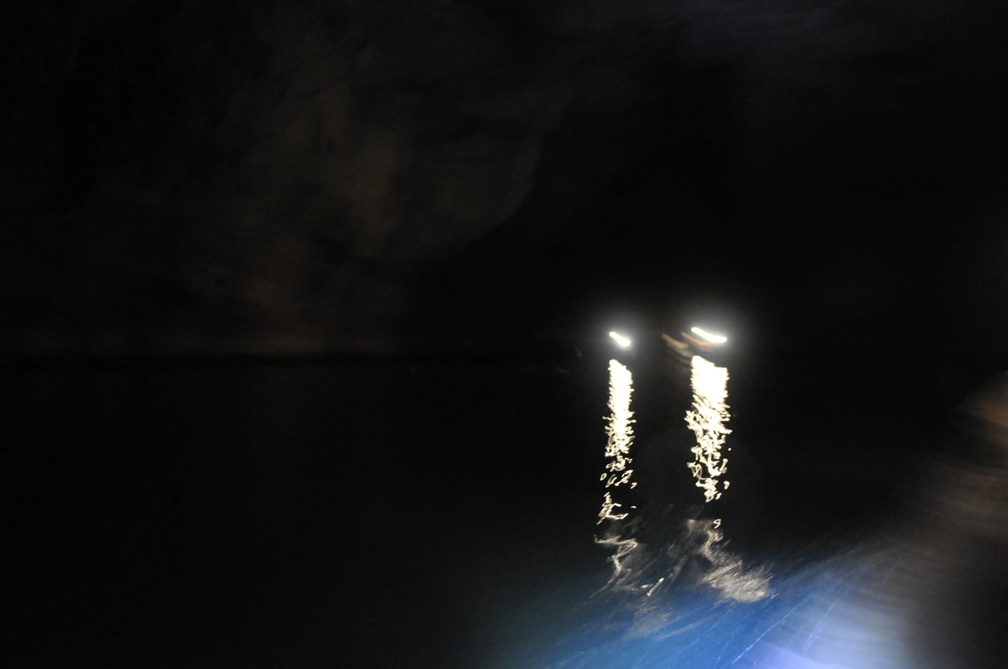 lights from other boats in Kong Lor Cave