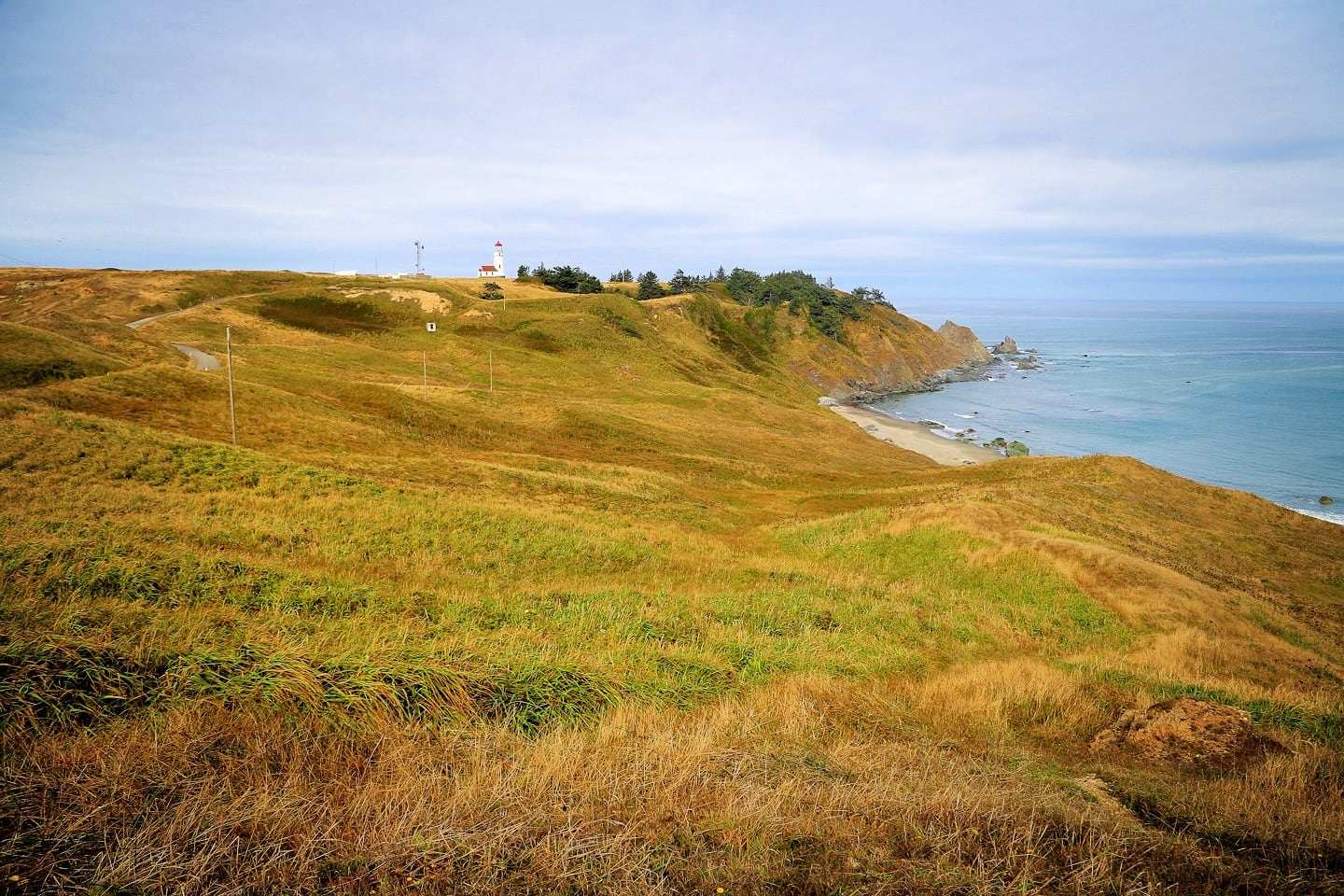 Cape Blanco Lighthouse on bluff overlooking ocean