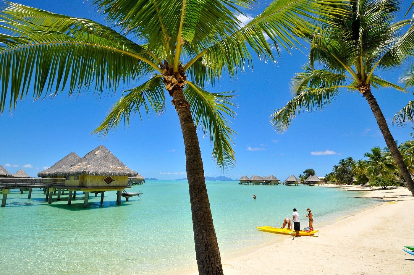 Bora Bora overwater bungalows and palm fringed beach