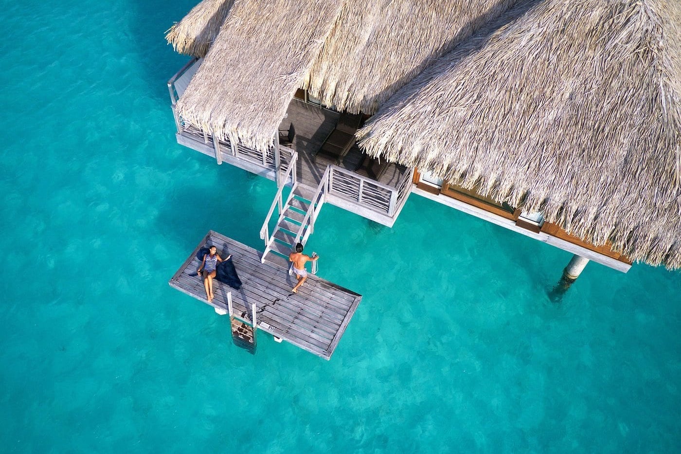 woman relaxing on sun deck at resort