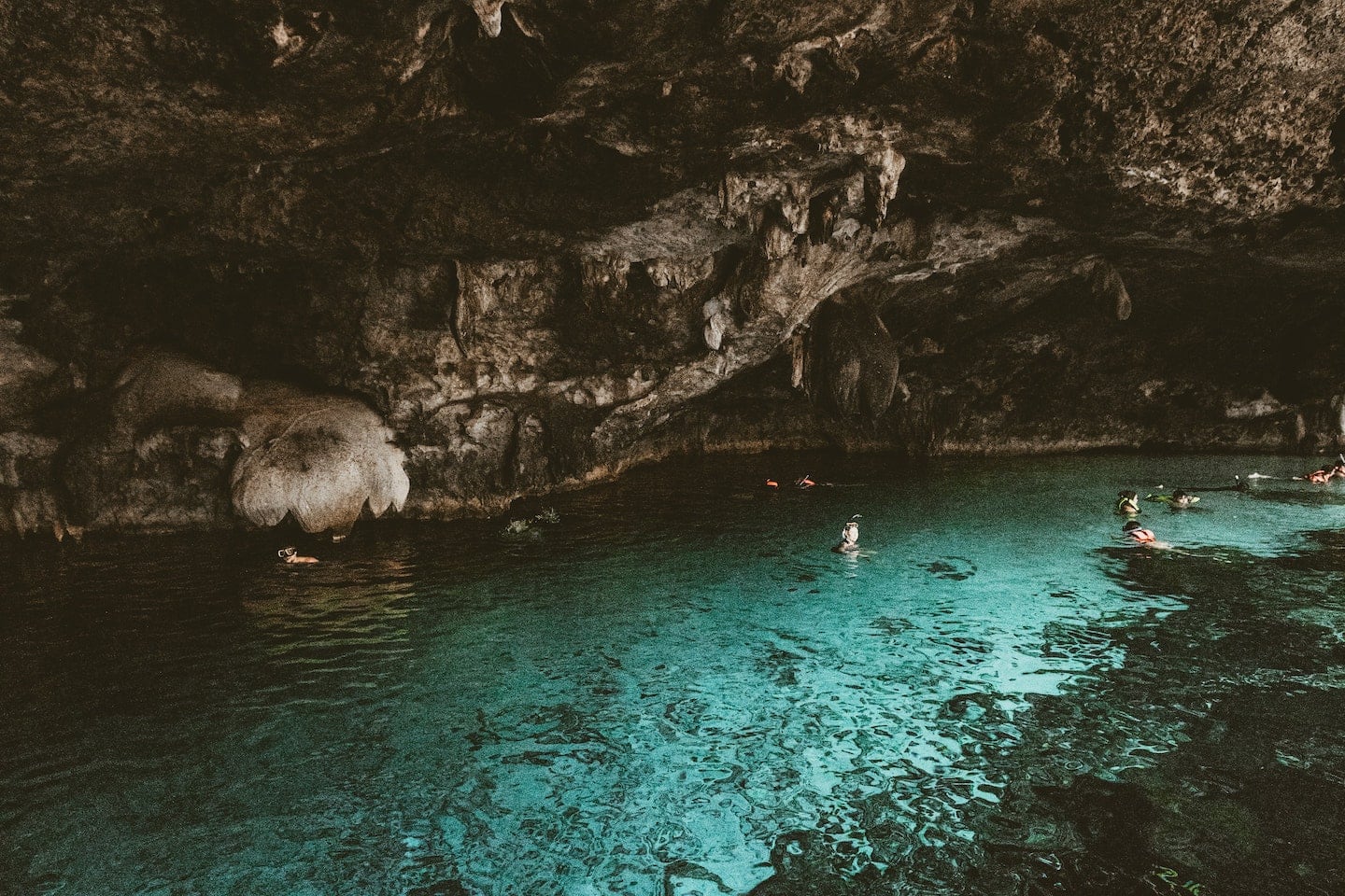 swimmers in cenotes near Tulum