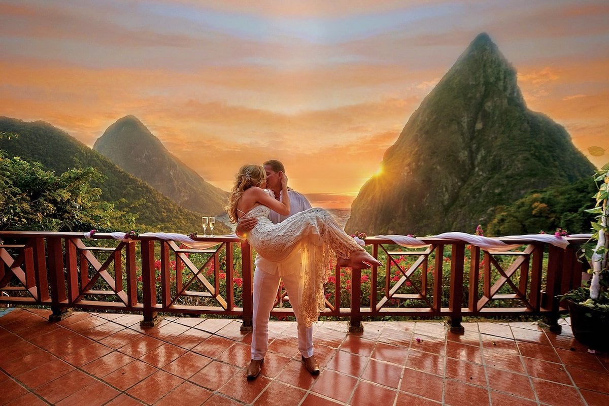 St Lucia honeymoon couple with Pitons and sunset