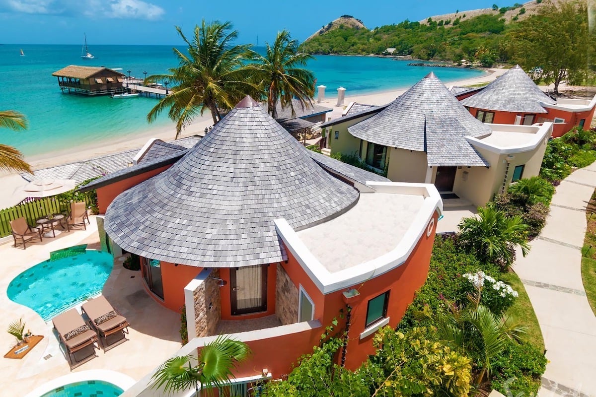 huts on the beach with pool