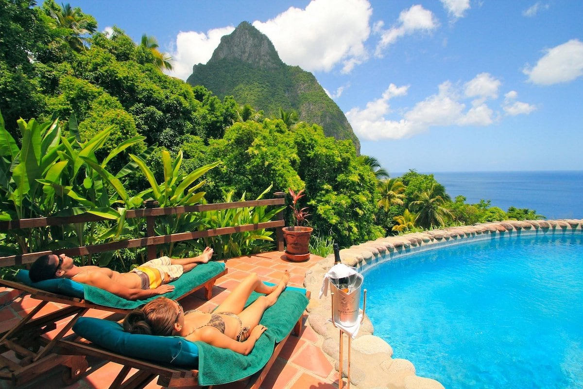 St. Lucia honeymoon couple poolside with mountain