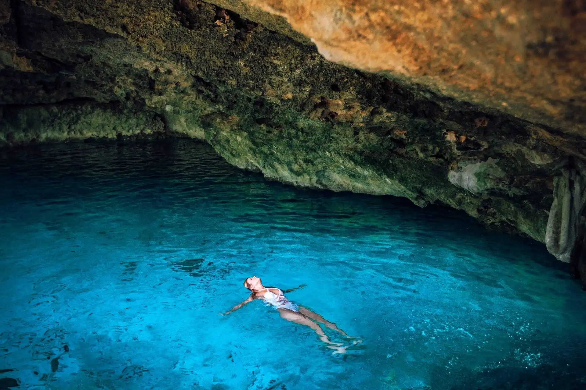 woman in water Tulum cenotes