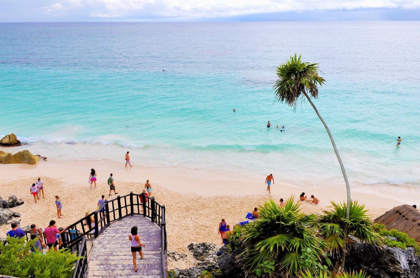 visitors on the beach in Tulum