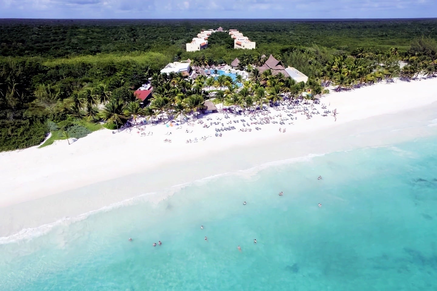 azure sea with luxury resort and white sands beach