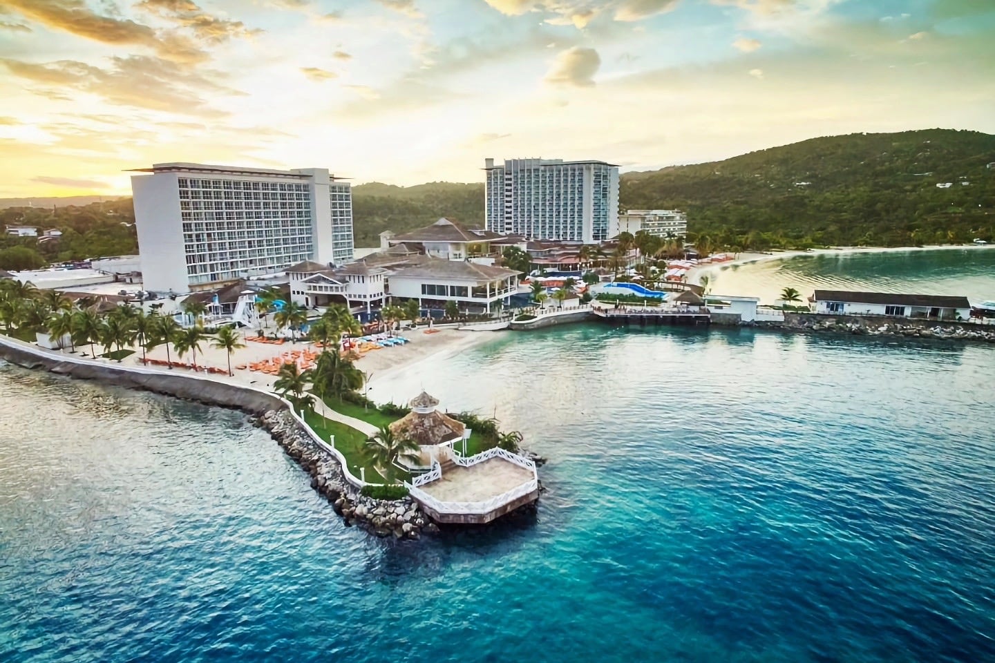 sunset behind luxury beach resort