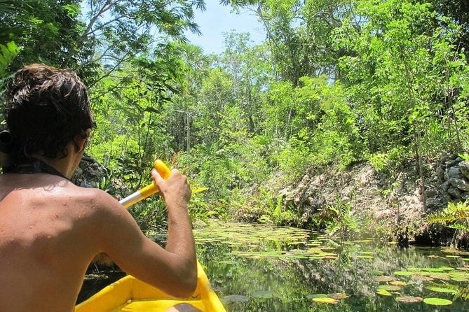 man on boat in jungle