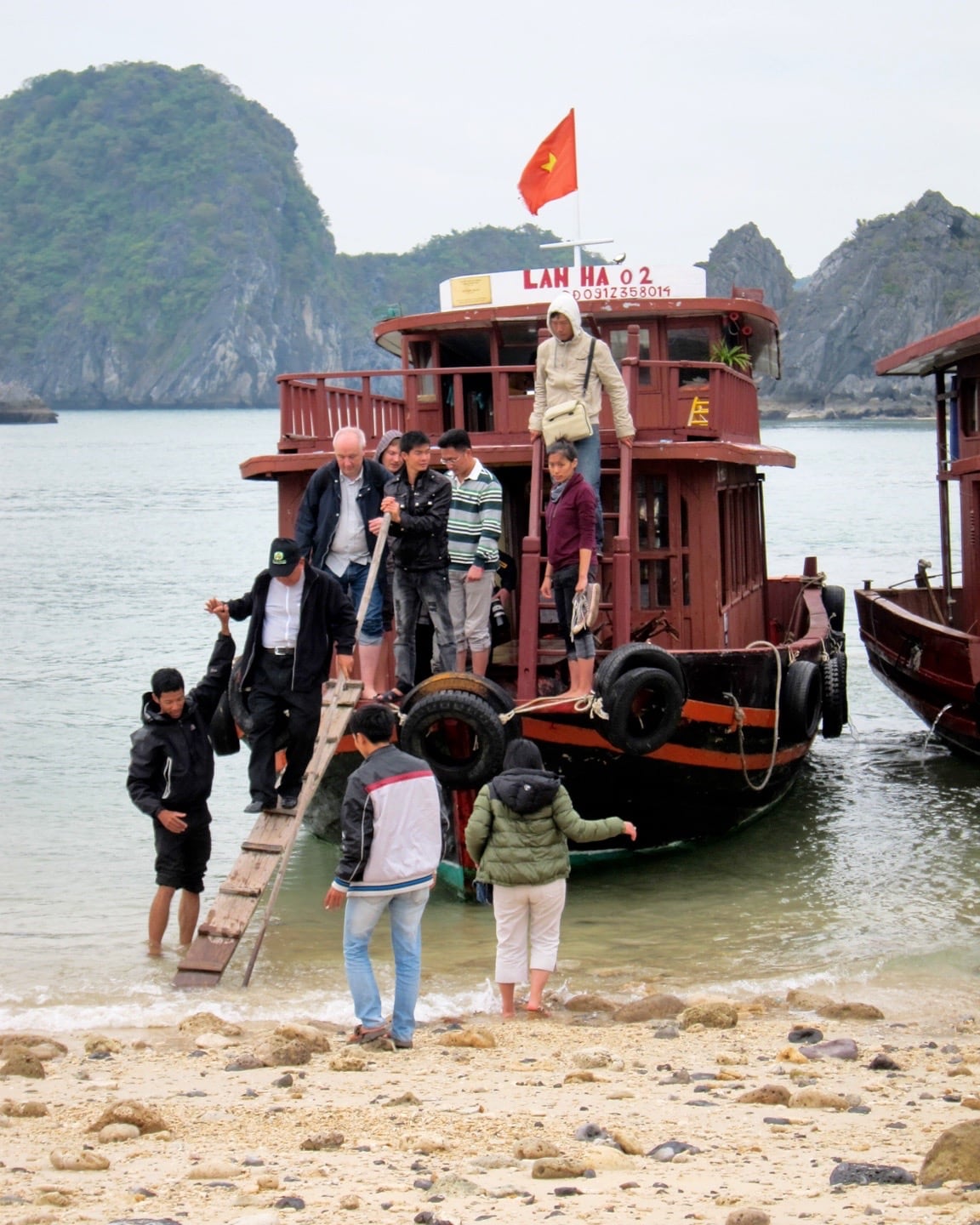 people disembarking from tender Vietnam