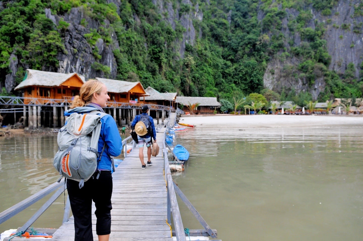 woman walking on dock to Cat Ba Island