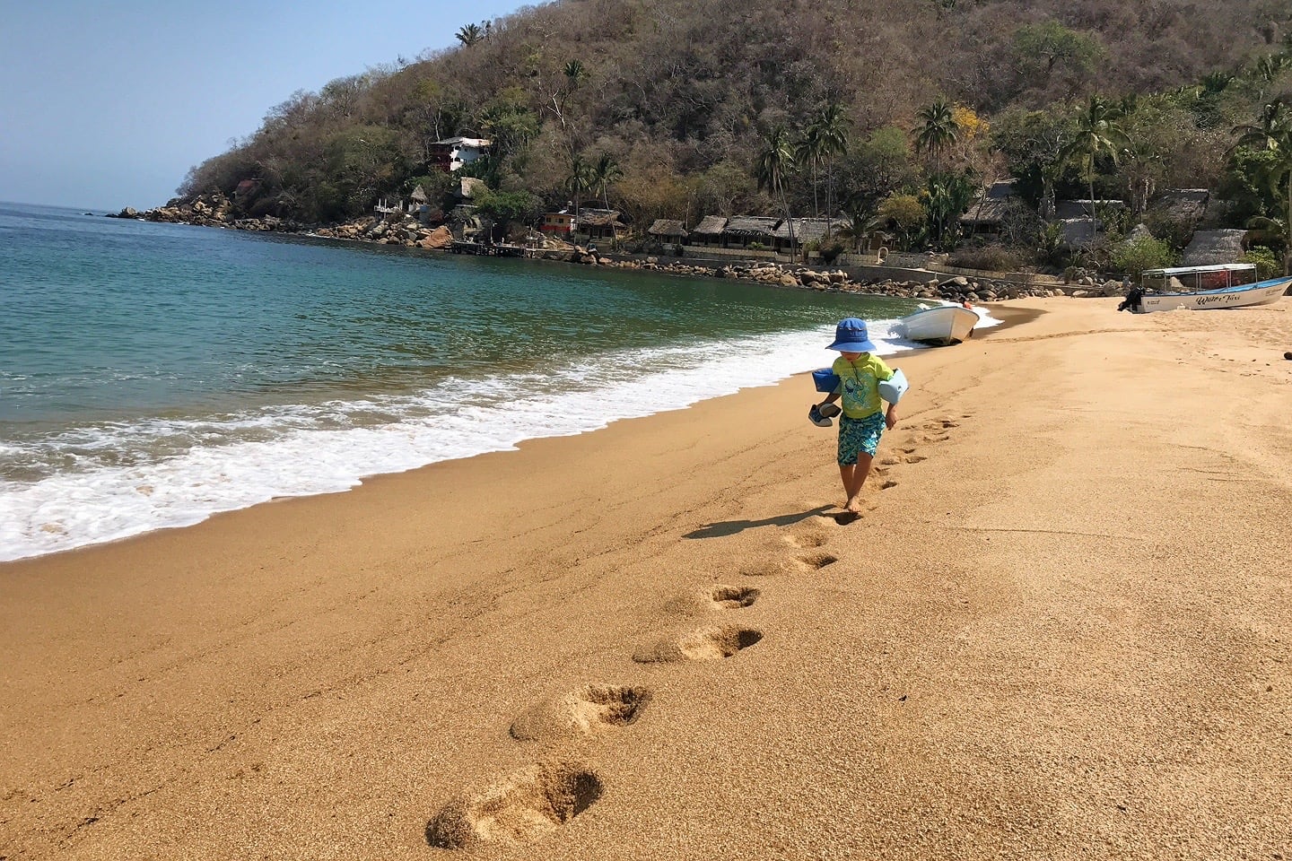 child walking along beach