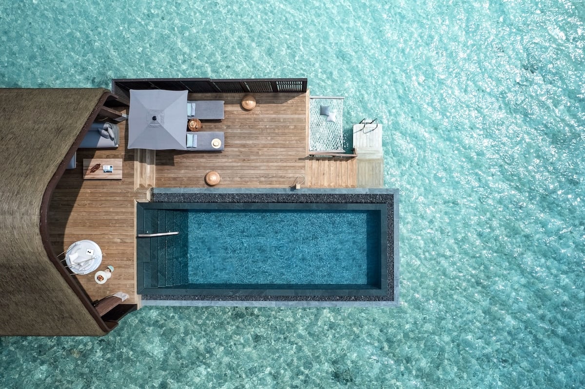 Joali Being resort pool surrounded by turquoise water