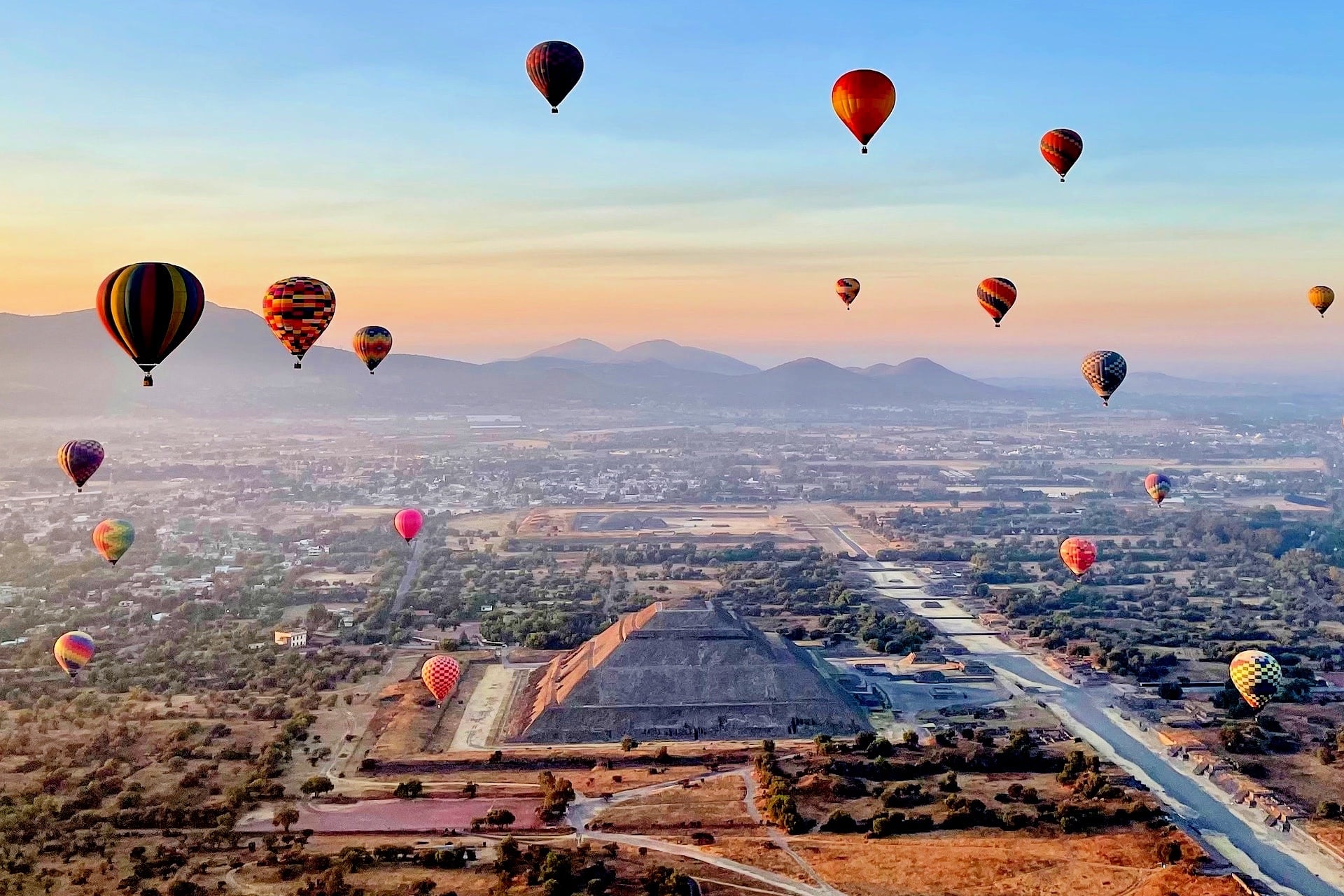 Teotihuacan Pueblo Magico pyramid and hot air balloons 