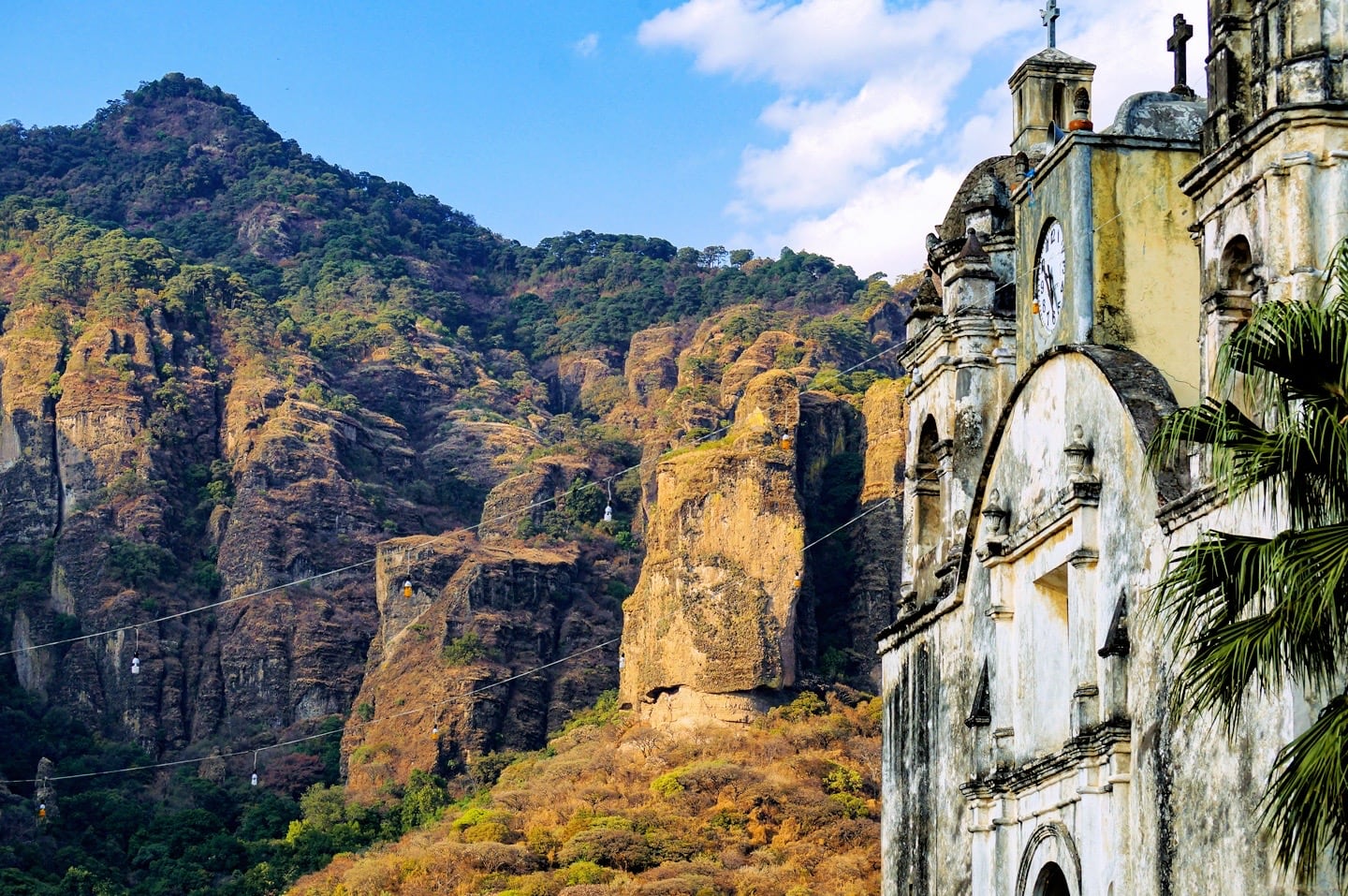 historic church and sheer cliffs in Tepoztlan Pueblo Magico