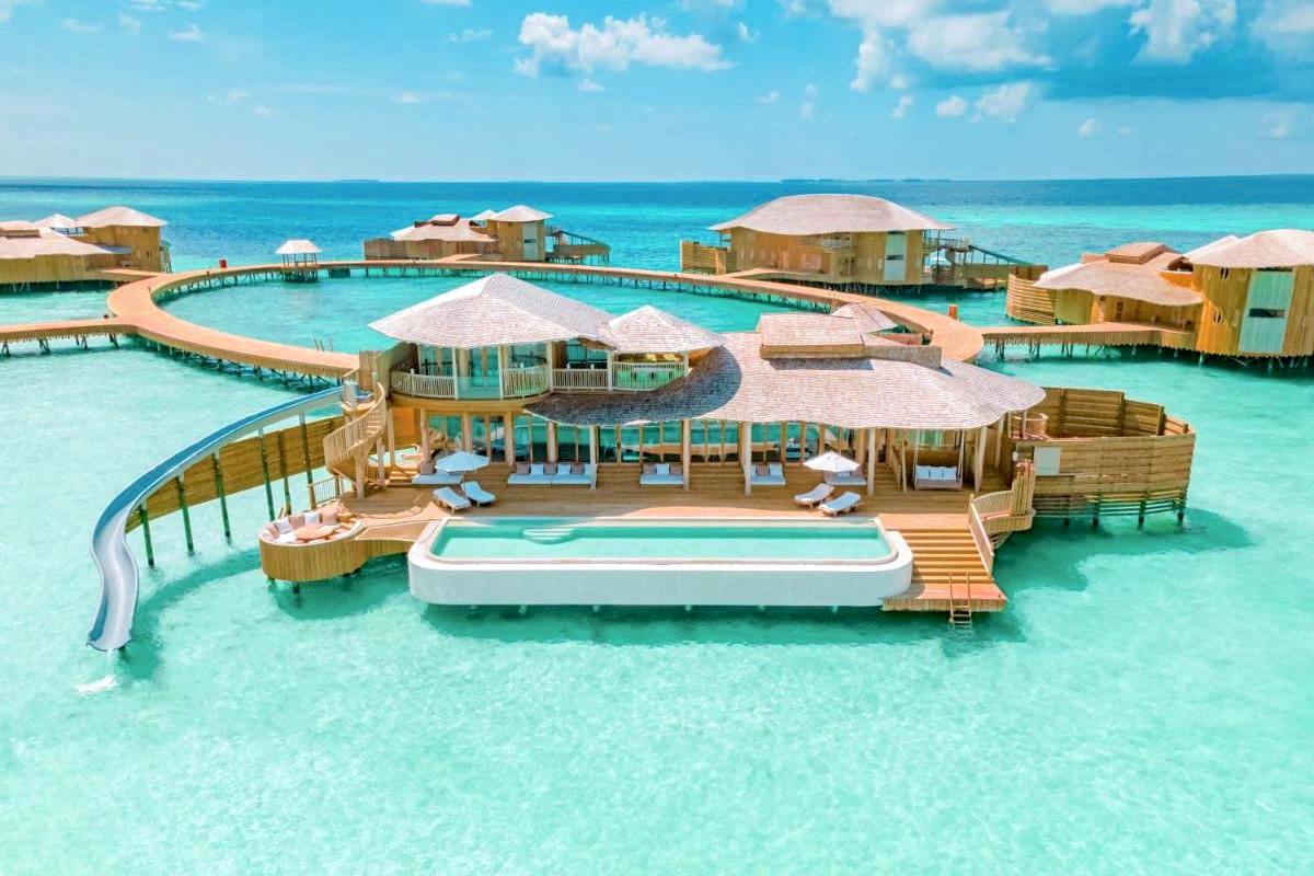 Maldives overwater bungalows with waterslide and pool